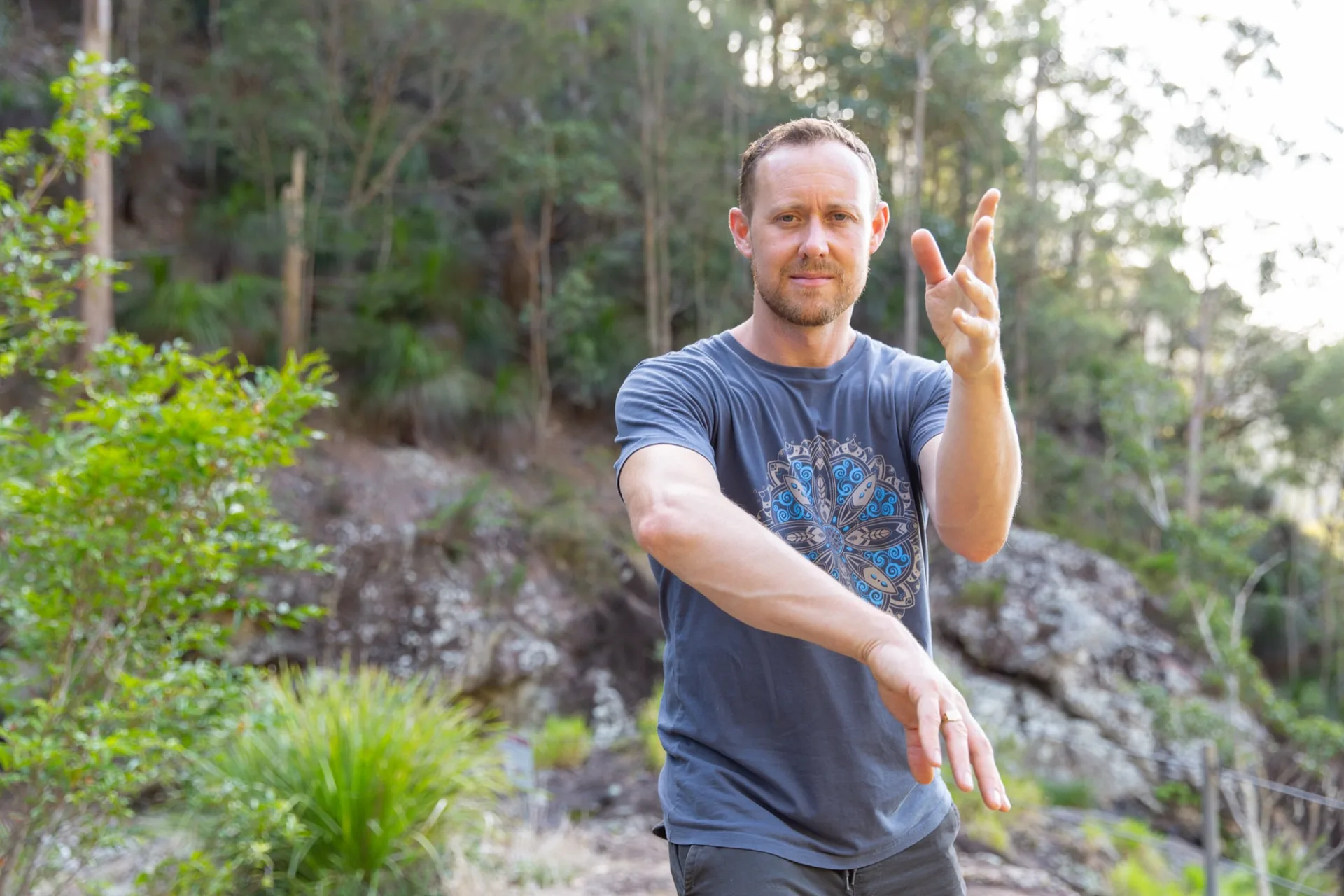 Ross Parkinson mid-movement, bush backdrop
