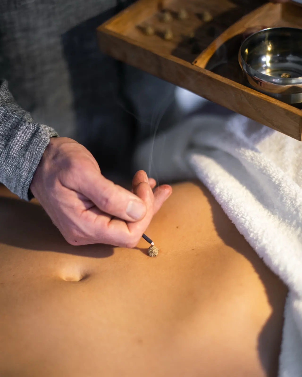 Traditional heat therapy being prepared